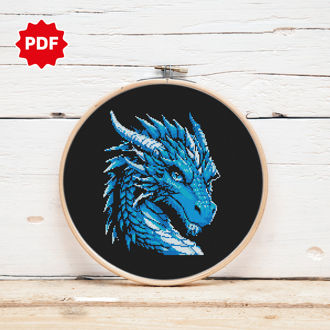 Blue dragon head cross stitch pattern with piercing eyes, fantasy design
