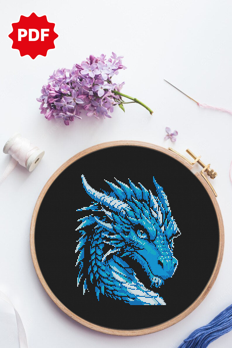 Close-up of blue dragon head with sharp gaze, detailed cross stitch